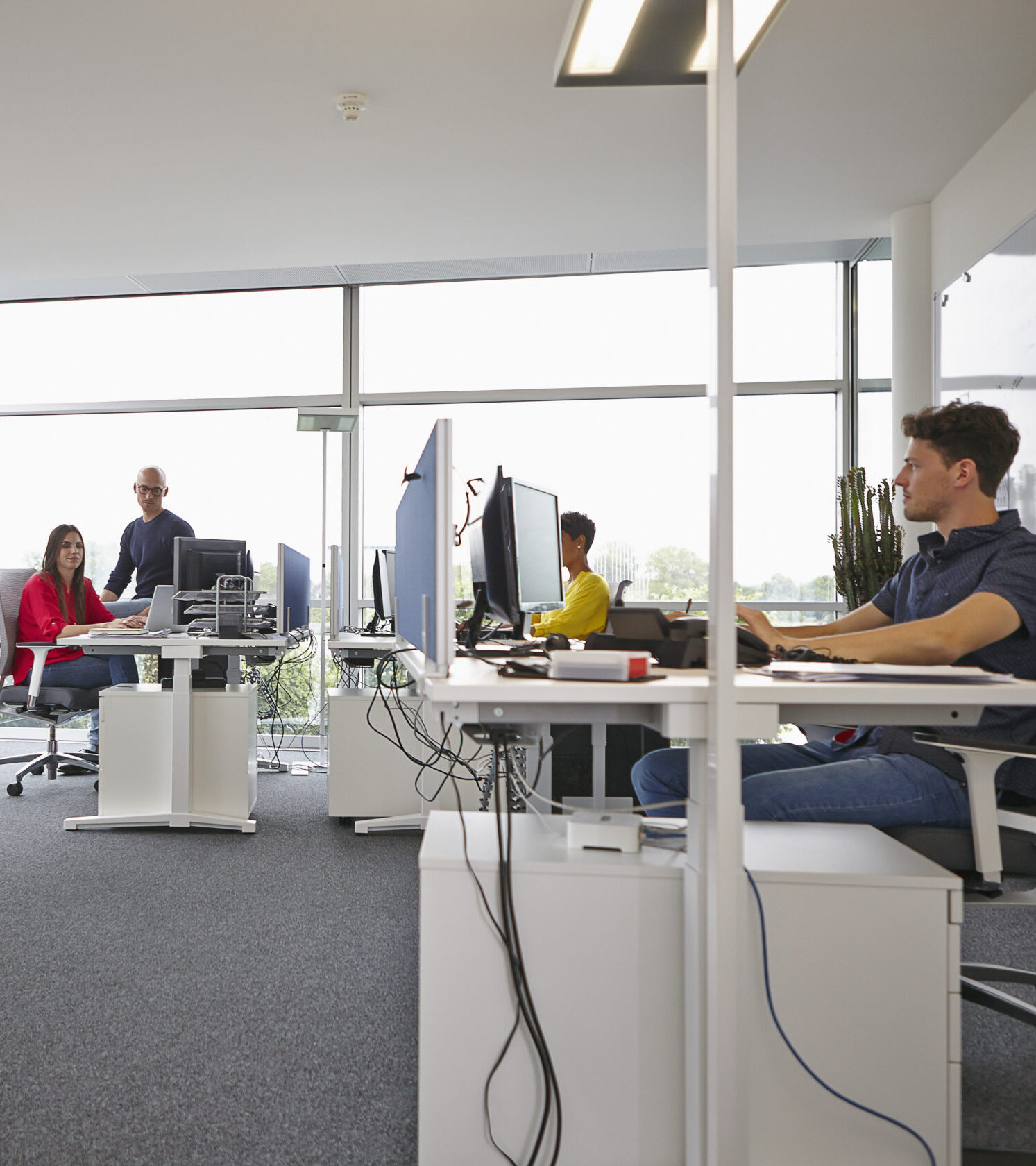 Colleagues working in open-plan office